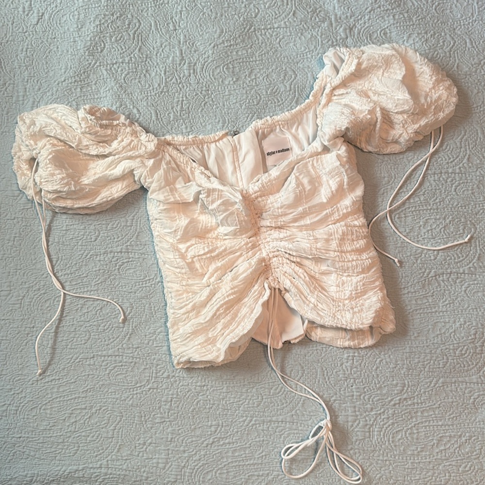 Isabelle’s cabinet white cinched puff sleeve crop top